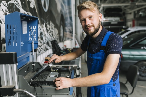 mechanic-using-notebook-garage